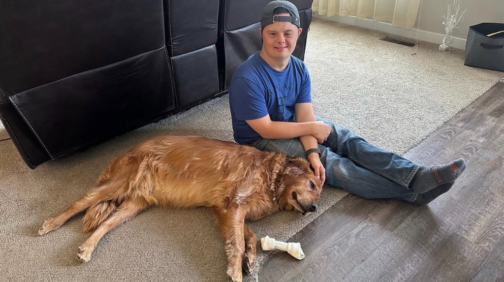 Nikita relaxing with a dog